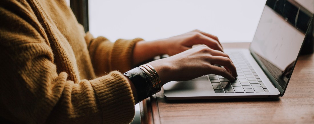 A person using a laptop computer