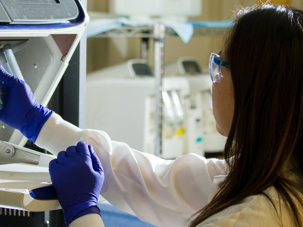 Woman working in a cancer lab