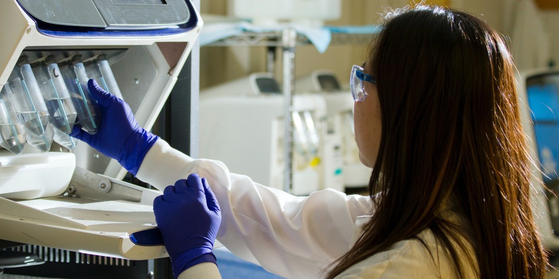 Woman working in a cancer lab